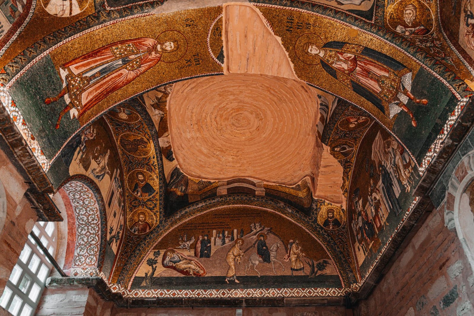 Historic Byzantine mosaics adorn the vaulted ceiling inside Chora Mosque in Istanbul.