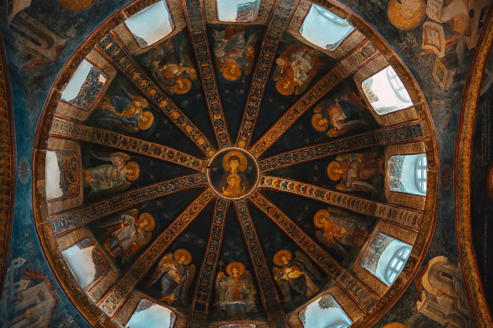Elaborate Christian frescoes decorate the domed ceiling of the Chora Mosque interior.