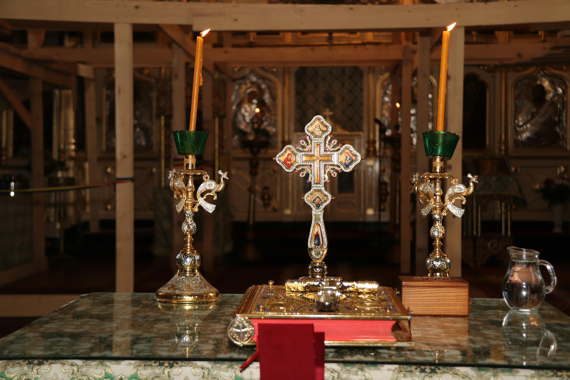 Ornate silver cross and liturgical items on the altar of the Church of St. George.