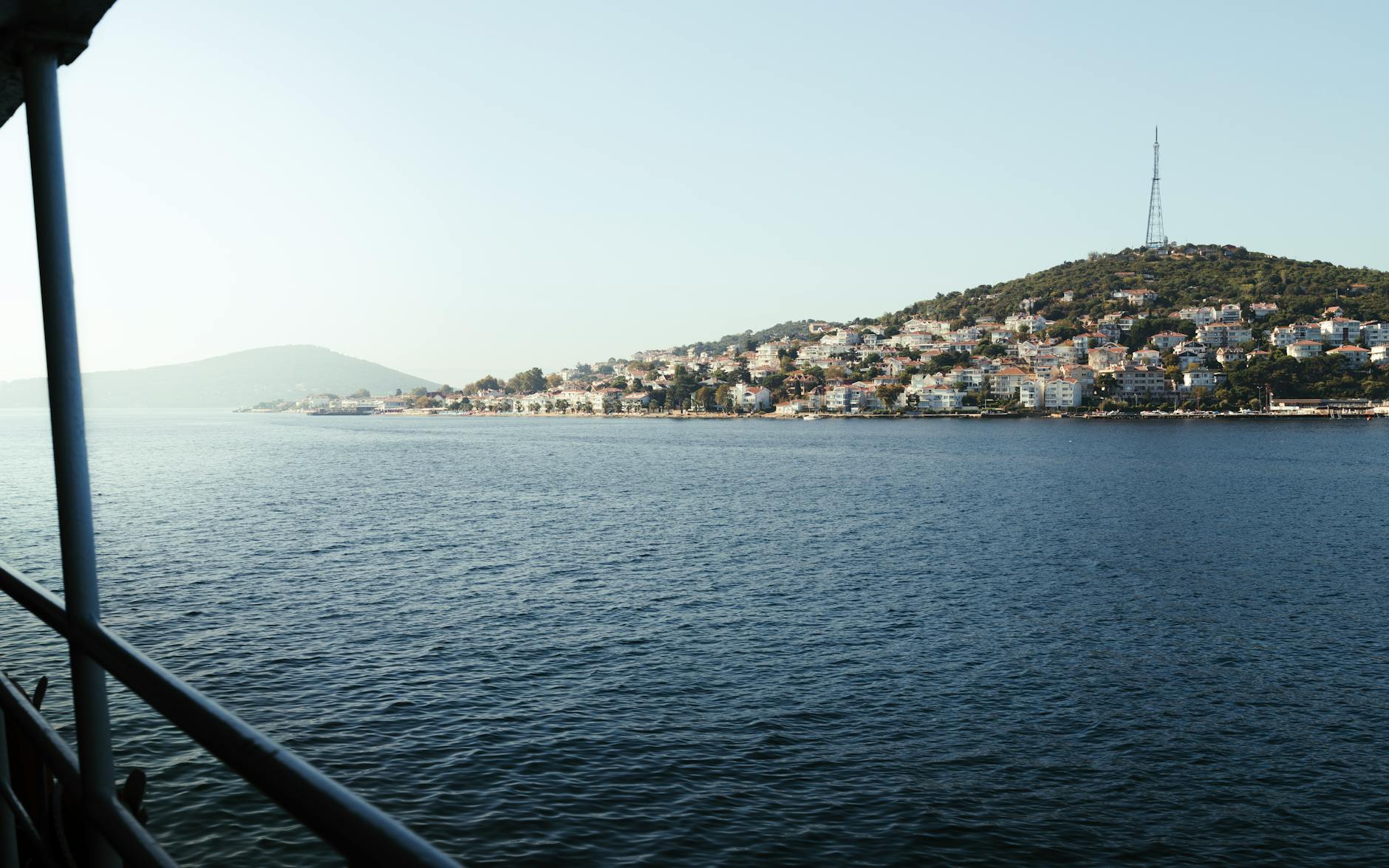 Passenger view from a ferry deck as it approaches the Princes Islands shoreline.