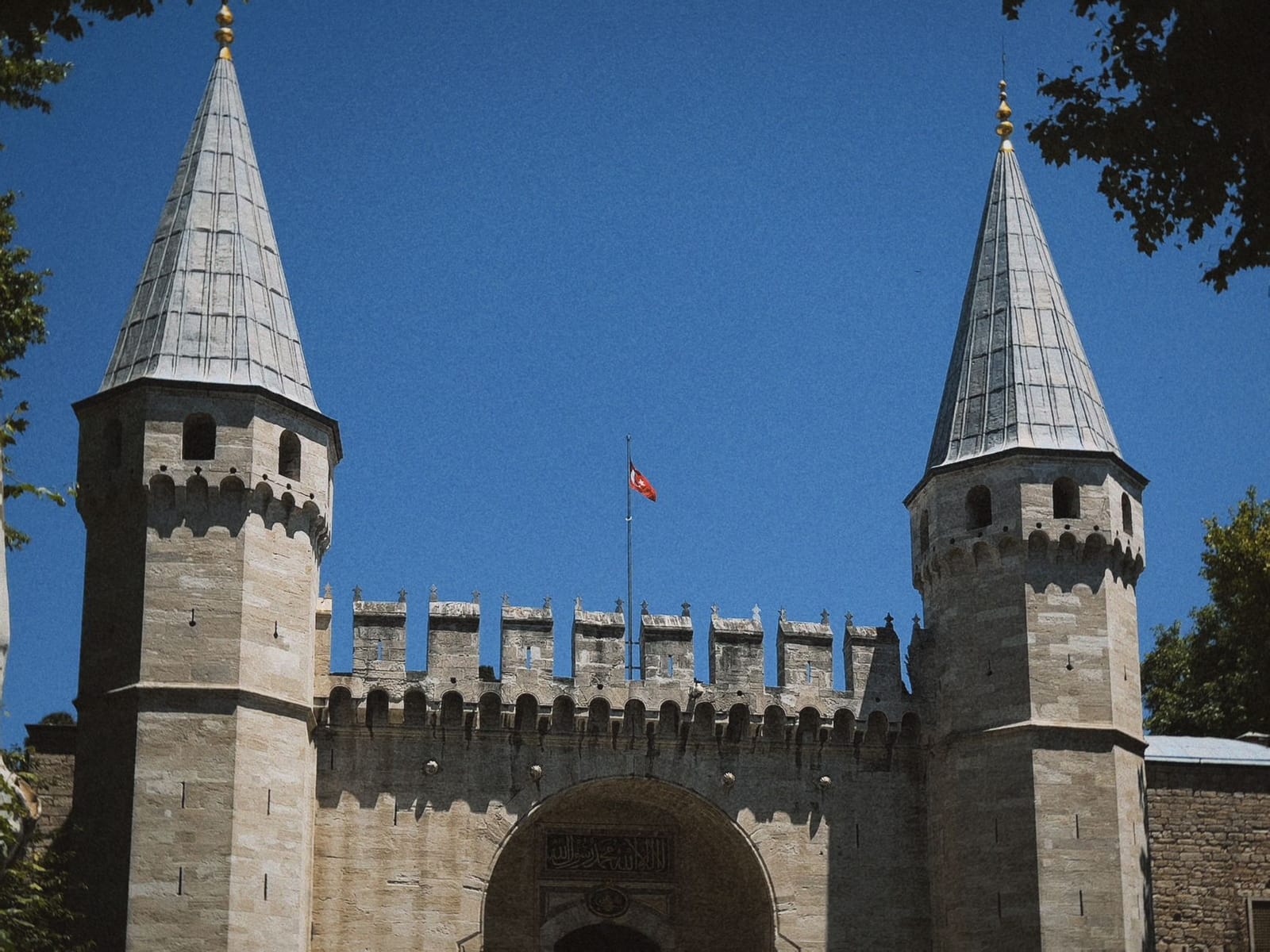 Twin towers flanking the Gate of Salutation entrance at Topkapi Palace in Istanbul.