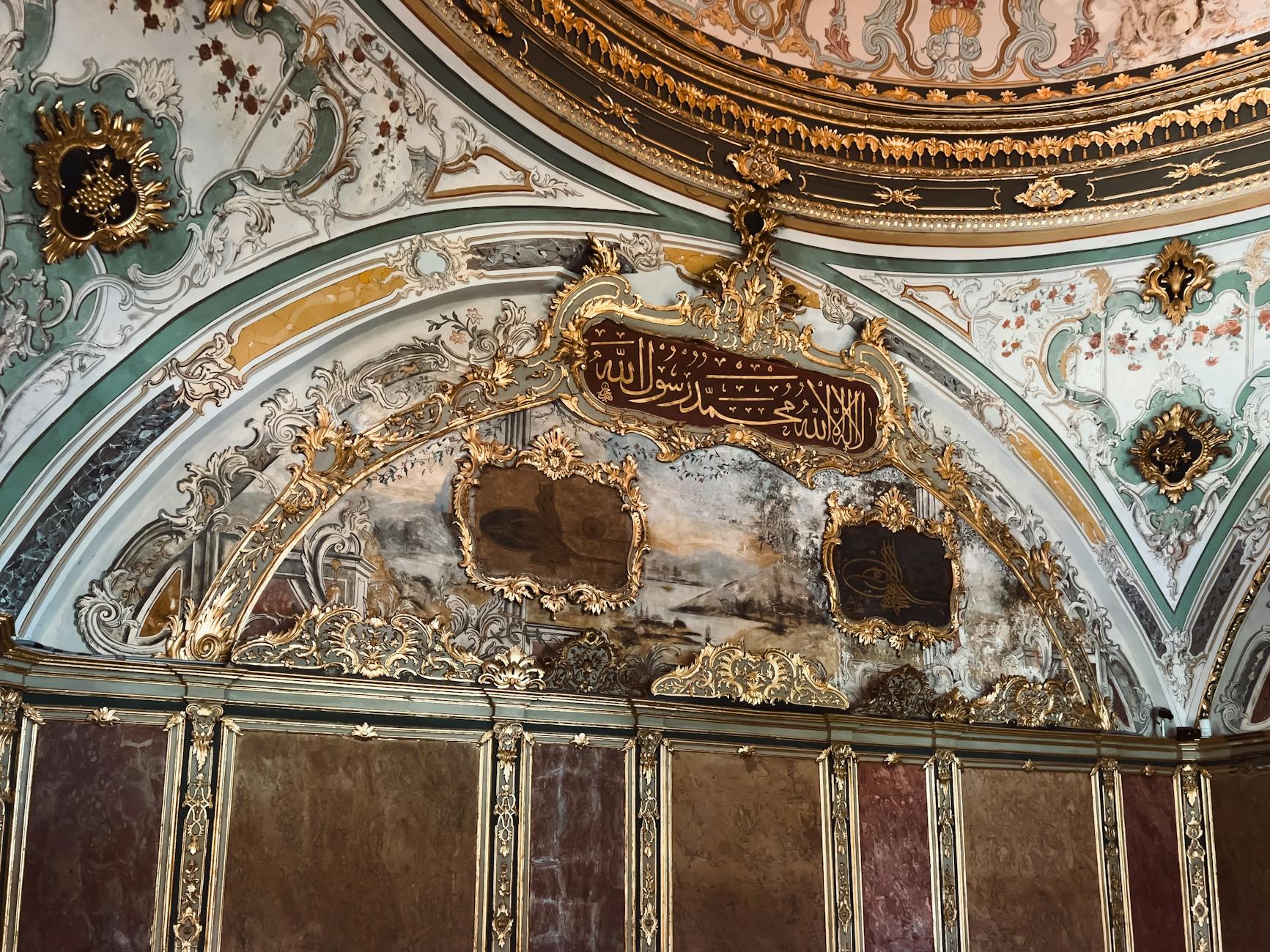Exquisite gold calligraphy and painted decorations on the ceiling of the Sultan Mahmud II tomb.