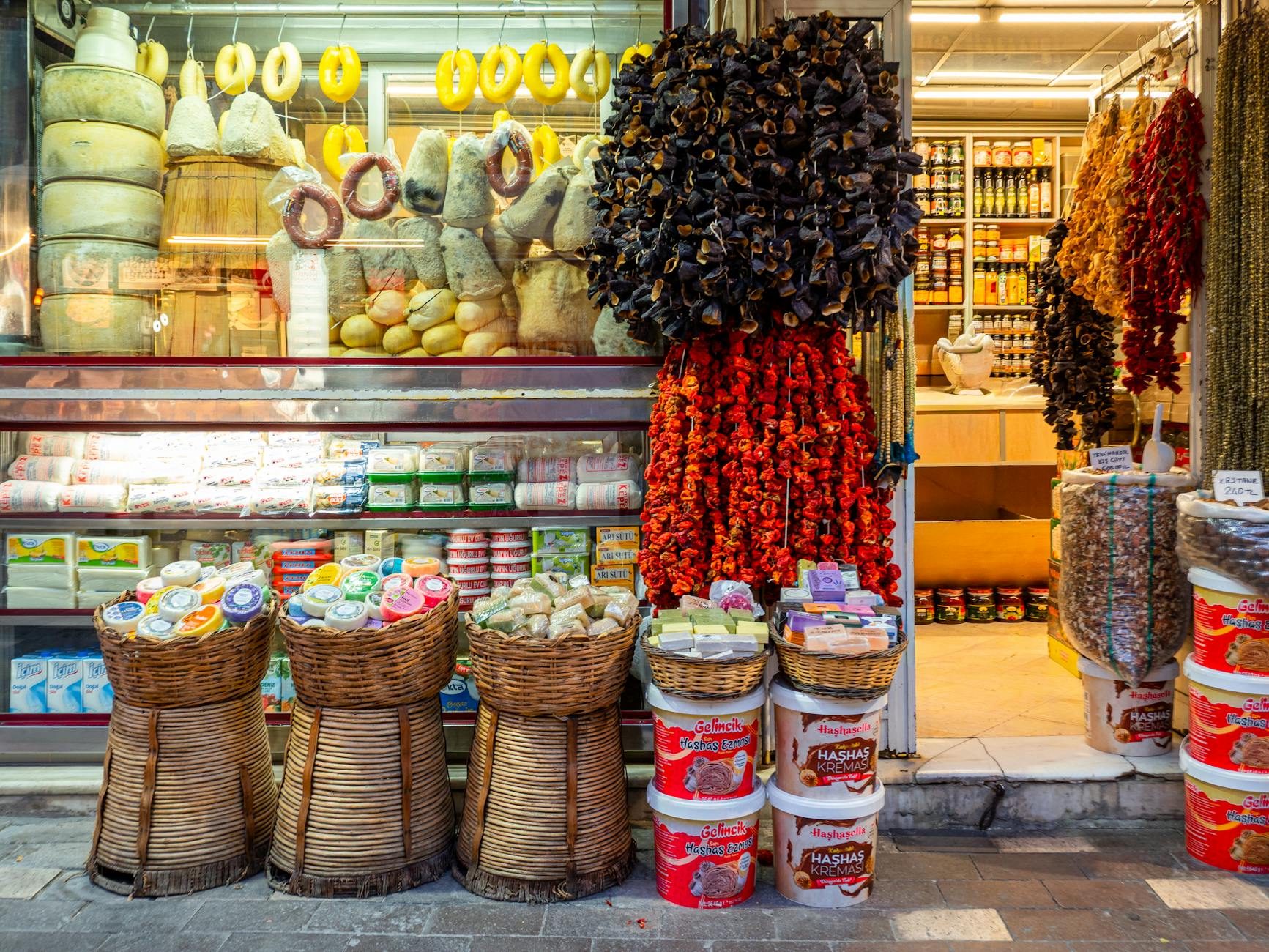 A vibrant display of cheeses and dried peppers at an Istanbul neighborhood shop.