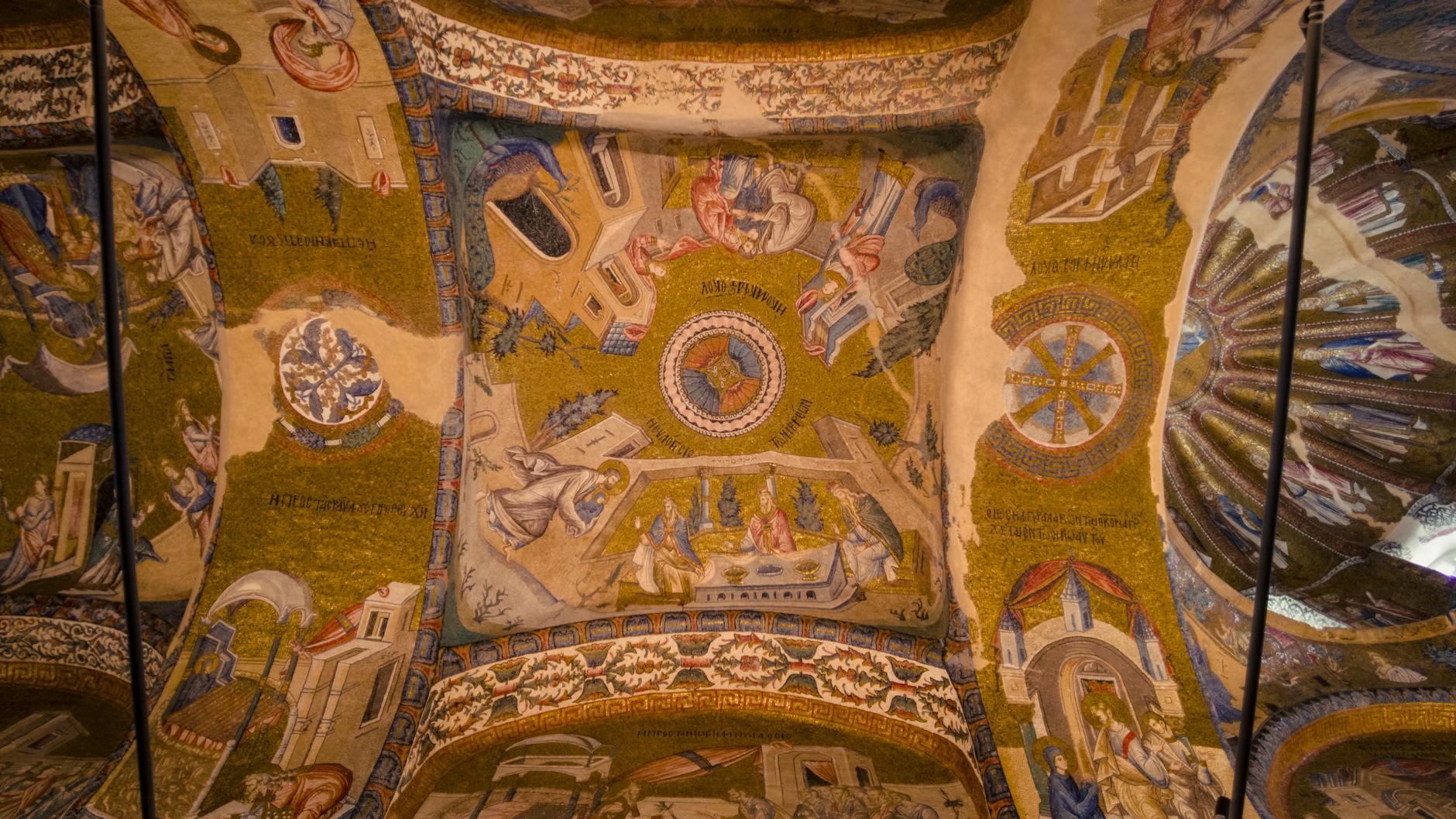 Close-up view of the stunning golden mosaic art covering the vaulted ceilings inside the Kariye Mosque (Chora Church) in Istanbul.