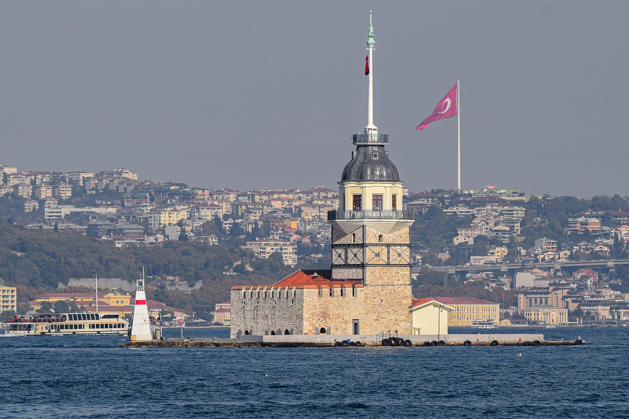 A detailed view of Maiden's Tower with the Istanbul city landscape behind.