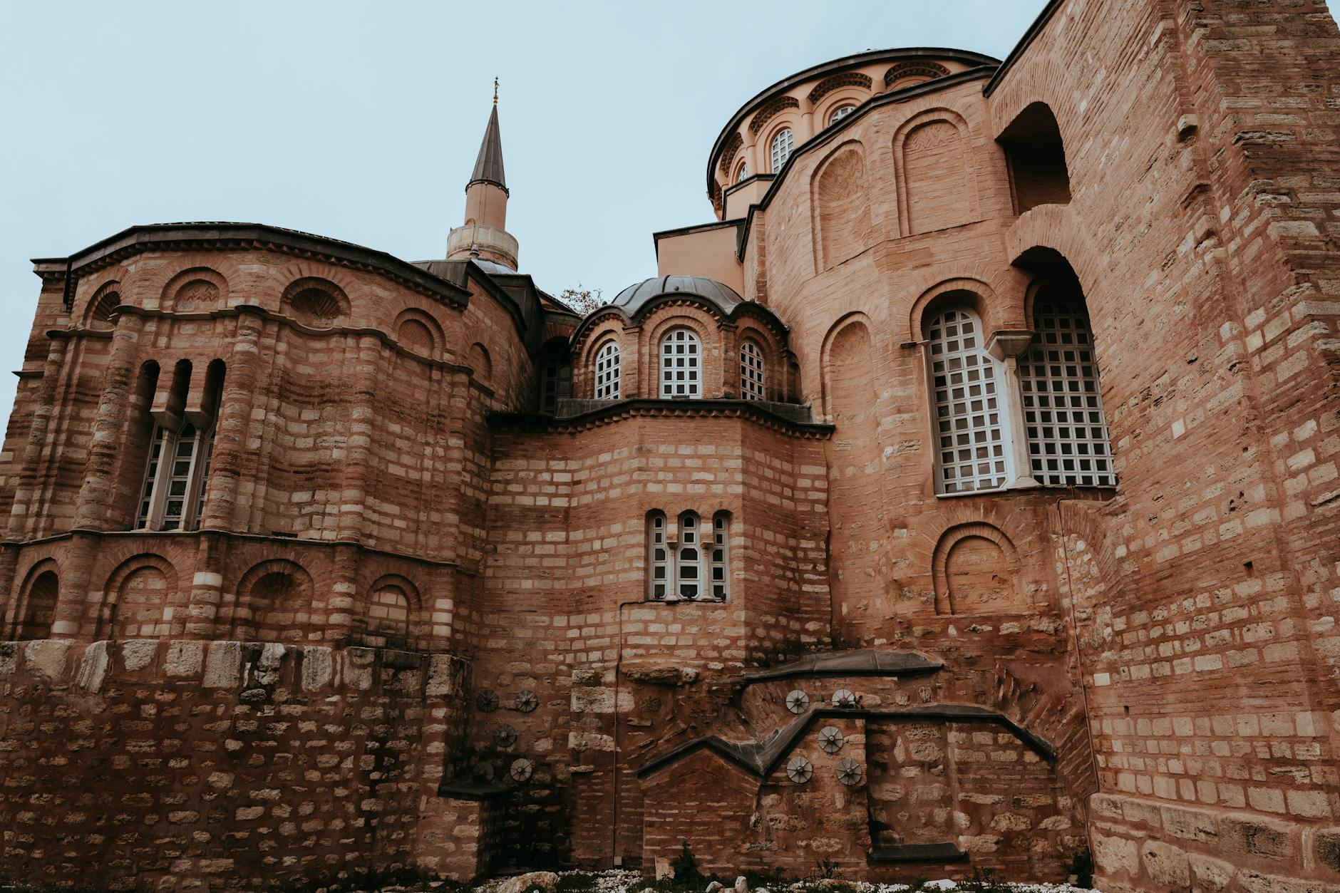 The brick exterior and multiple domes of the historic Pammakaristos Church in Istanbul.