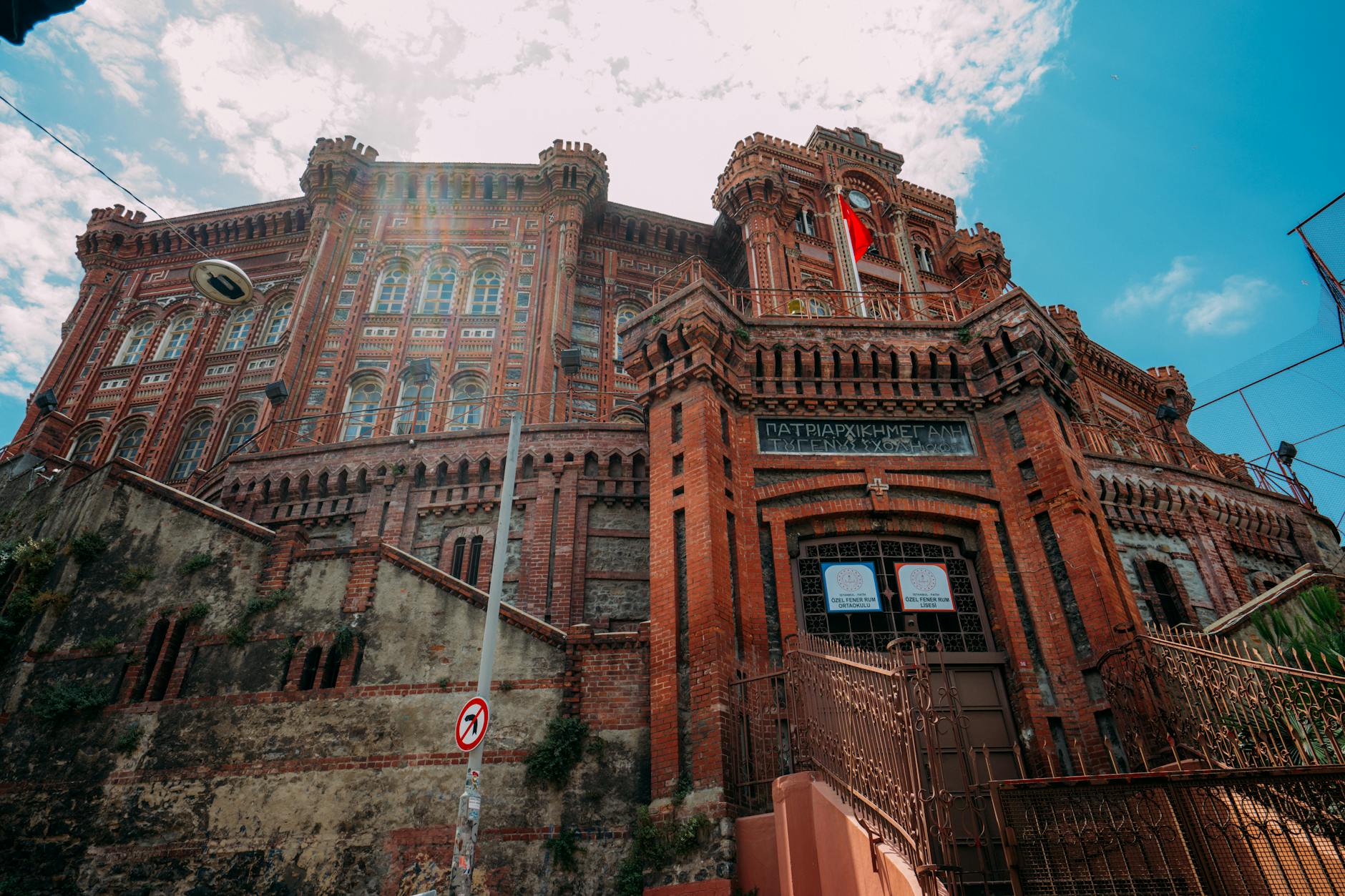 The majestic red brick facade of the Phanar Greek Orthodox College in Fener, Istanbul.
