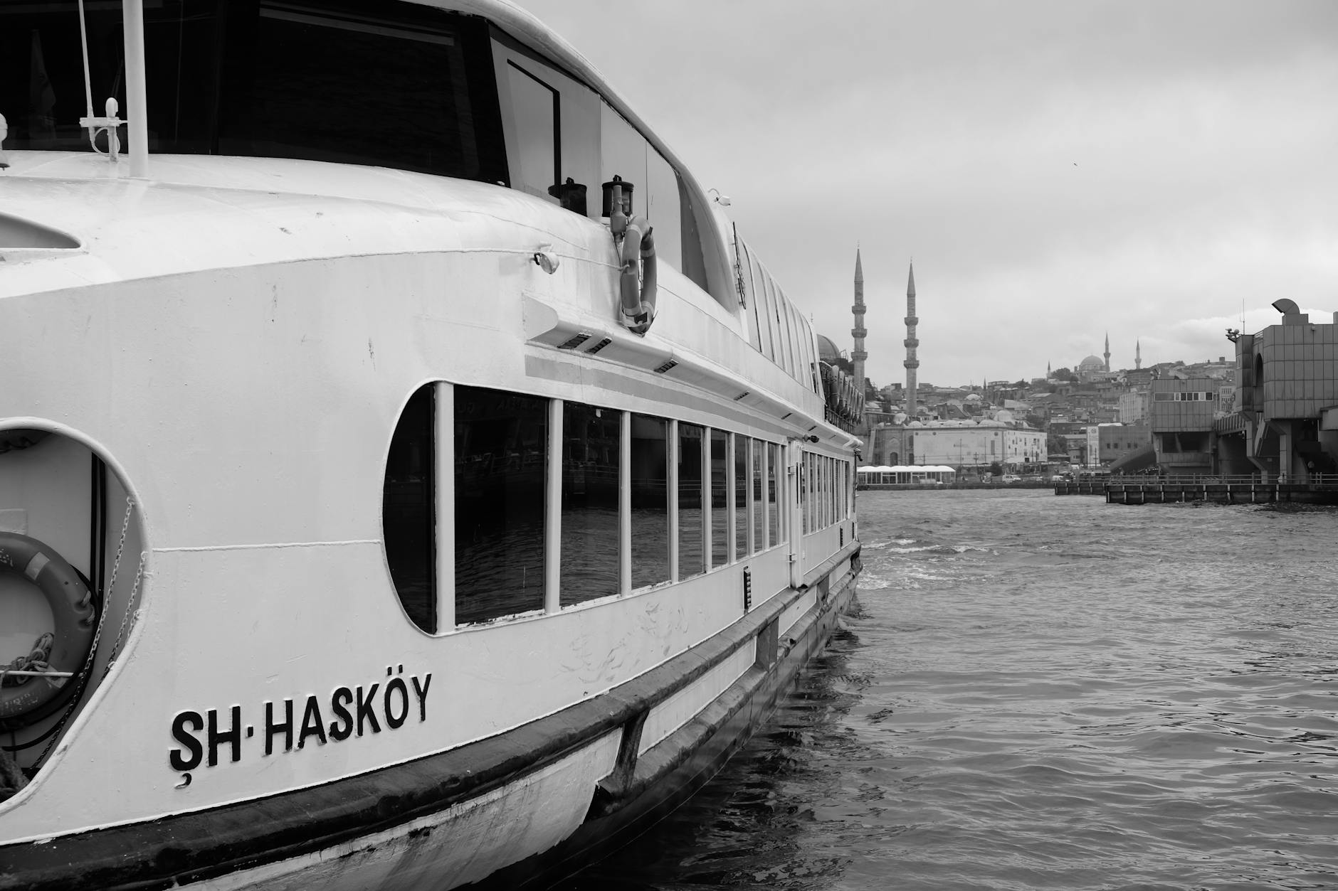 A black and white view of the Hasköy passenger ferry on the Istanbul waterfront.