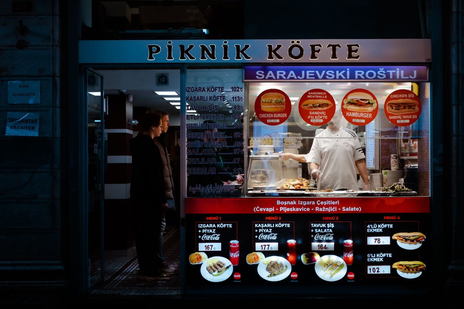 Traditional Turkish meatball shop front displaying grilled kofte and piyaz prices.